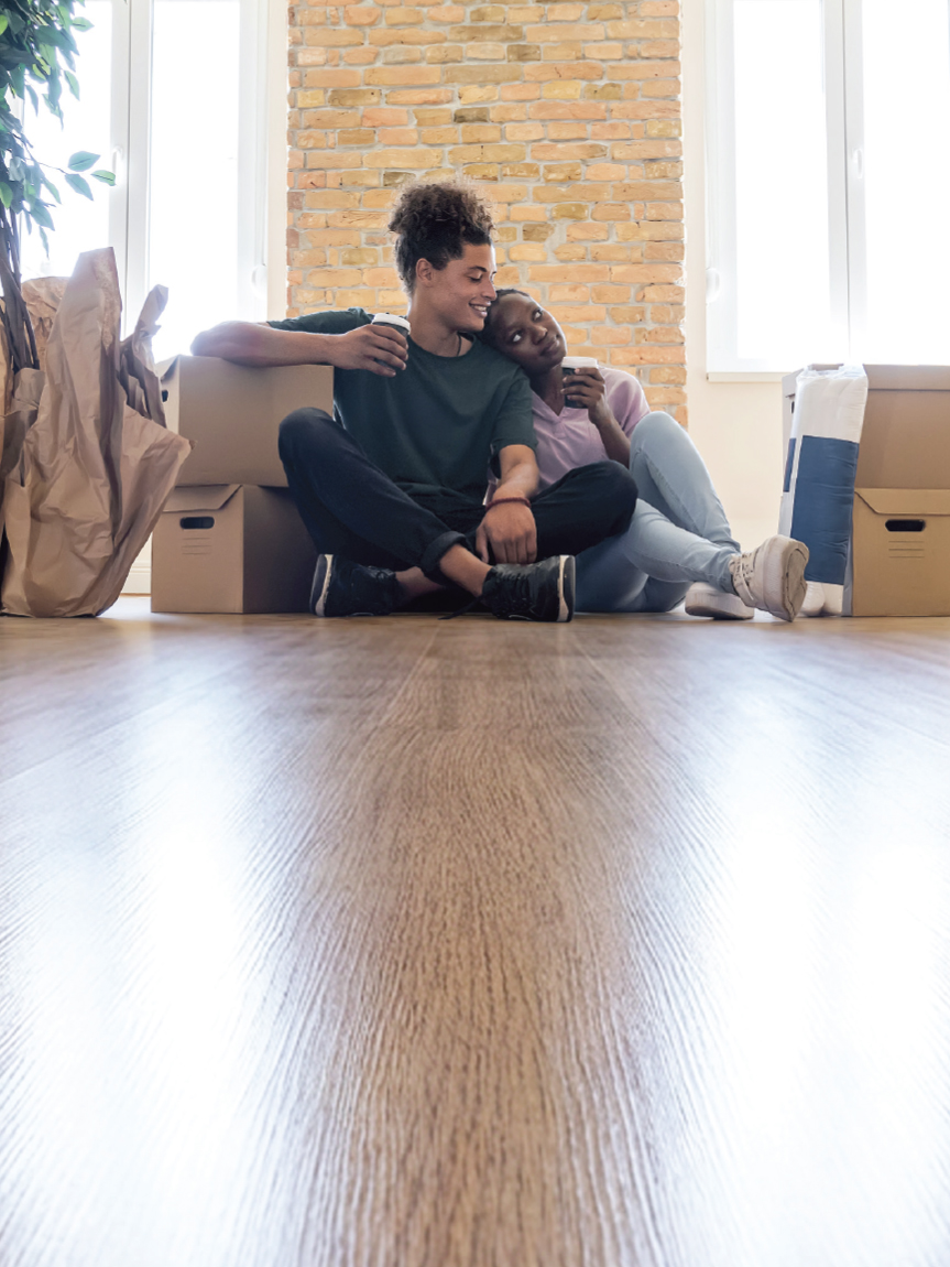 Couple sitting on Luxury Vinyl Floor